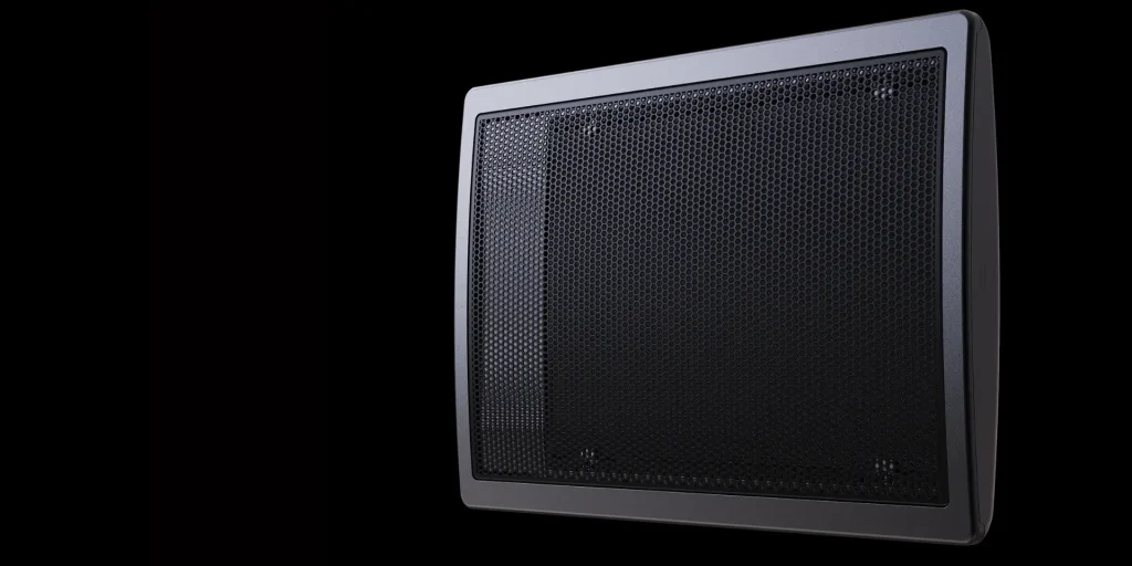 A black vented radiator cover with a perforated metal front panel is shown against a solid black background.