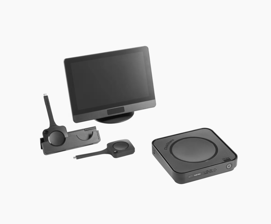 A touchscreen monitor, a wireless presentation button, a docking station, and a control pad are displayed on a white background.