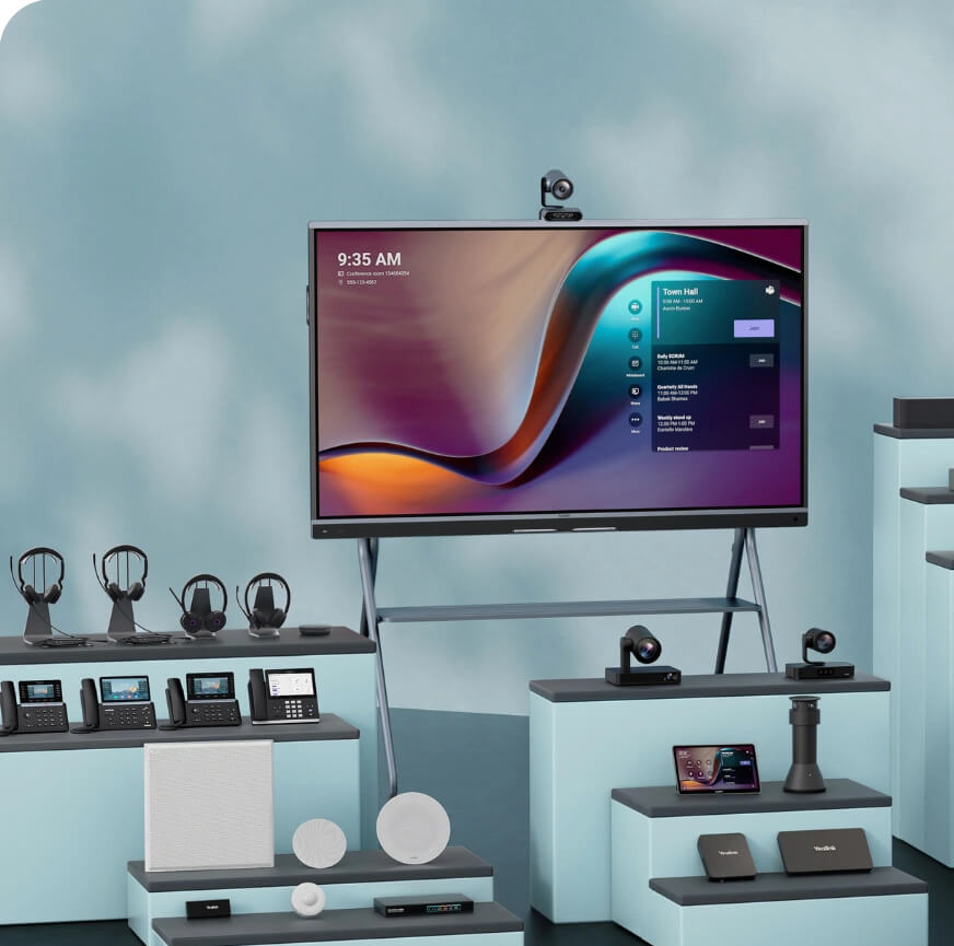 A display screen with a video conferencing interface is surrounded by various communication devices and accessories on light blue platforms.